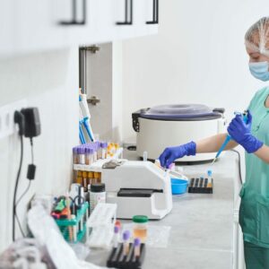 Female in medical suit working in laboratory
